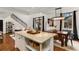 Kitchen island with granite countertop, connecting to the dining room and staircase at 2626 Peachtree Nw Rd # 206, Atlanta, GA 30305