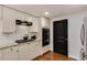 Well-lit kitchen featuring white cabinets, granite countertops, and stainless-steel appliances at 2626 Peachtree Nw Rd # 206, Atlanta, GA 30305