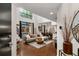 Spacious living room features hardwood floors, large windows, and a comfortable sectional couch at 2626 Peachtree Nw Rd # 206, Atlanta, GA 30305