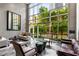 Inviting lobby area with comfortable seating, tall windows, and a modern aesthetic creating a welcoming atmosphere at 2626 Peachtree Nw Rd # 206, Atlanta, GA 30305
