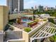 Inviting rooftop terrace featuring a hot tub, comfortable seating, and a trellis, perfect for relaxation at 2626 Peachtree Nw Rd # 206, Atlanta, GA 30305