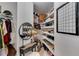 Organized walk-in closet featuring ample shelving, storage solutions, and neutral decor at 2626 Peachtree Nw Rd # 206, Atlanta, GA 30305