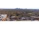 Aerial view of the city showcasing a skyline beyond lush trees and neighborhood streets at 325 E Paces Ferry Ne Rd # 2005, Atlanta, GA 30305