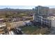 Aerial view of cityscape featuring new construction, restaurants, and a pet park at 325 E Paces Ferry Ne Rd # 2005, Atlanta, GA 30305