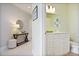 Bright bathroom featuring a white vanity with drawers, decorative mirror, and fresh decor at 325 E Paces Ferry Ne Rd # 2005, Atlanta, GA 30305