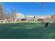 Community park with picnic tables, dog runs, and string lights against a sunny sky at 325 E Paces Ferry Ne Rd # 2005, Atlanta, GA 30305