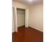 Bedroom featuring hardwood floors, neutral walls and large closet with white doors at 4351 Timberlake, Stone Mountain, GA 30083