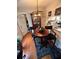 Inviting dining area with modern chandelier, wooden table, and view into kitchen at 4351 Timberlake, Stone Mountain, GA 30083