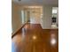 Open-concept living room with hardwood floors, view into dining area and kitchen at 4351 Timberlake, Stone Mountain, GA 30083