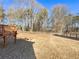 Expansive backyard with a wooden deck and a wooden fence at 5025 Skipping Stone Ct, Cumming, GA 30028