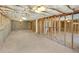 Spacious unfinished basement with exposed ceiling and frame, and concrete floor at 5025 Skipping Stone Ct, Cumming, GA 30028