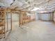 Unfinished basement area showcasing exposed beams and concrete floors at 5025 Skipping Stone Ct, Cumming, GA 30028