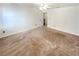 Spacious bedroom with neutral carpet, ceiling fan, and a connecting door at 5025 Skipping Stone Ct, Cumming, GA 30028