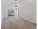 Large bedroom featuring a ceiling fan and sliding doors to the backyard at 5025 Skipping Stone Ct, Cumming, GA 30028