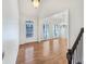 This foyer features wood floors, stairs, and natural light at 5025 Skipping Stone Ct, Cumming, GA 30028