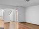 Living room with hardwood floors, archway, and interior doorways at 5589 Dendy Trace, Fairburn, GA 30213