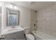 Updated bathroom with marble-look tile shower, modern vanity, and framed mirror at 8483 Magnolia Dr, Jonesboro, GA 30238