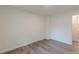 Cozy bedroom showing the neutral walls and wood-look flooring at 8483 Magnolia Dr, Jonesboro, GA 30238