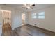 Bright bedroom featuring new flooring, updated trim, and natural light from two windows at 8483 Magnolia Dr, Jonesboro, GA 30238