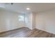 Finished basement bedroom featuring wood-look flooring and a storage closet at 8483 Magnolia Dr, Jonesboro, GA 30238