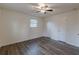 A cozy bedroom with new floors and one window providing natural light at 8483 Magnolia Dr, Jonesboro, GA 30238