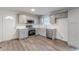 Modern kitchen with stainless steel appliances, gray cabinets, and subway tile backsplash at 8483 Magnolia Dr, Jonesboro, GA 30238