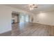 Open floor plan connecting the living room and kitchen, with modern flooring at 8483 Magnolia Dr, Jonesboro, GA 30238