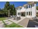 Expansive backyard features a patio with stylish seating and manicured lawn at 115 17Th Ne St, Atlanta, GA 30309