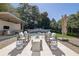 Gorgeous backyard offers outdoor seating, an outdoor kitchen, swimming pool, and meticulous landscaping at 115 17Th Ne St, Atlanta, GA 30309