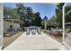 Gorgeous backyard offers outdoor seating, an outdoor kitchen, swimming pool, and meticulous landscaping at 115 17Th Ne St, Atlanta, GA 30309