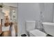 Bathroom featuring a freestanding tub, toilet, and a view to the fireplace at 115 17Th Ne St, Atlanta, GA 30309