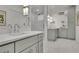 Bright bathroom featuring custom vanity cabinets and a glass shower at 115 17Th Ne St, Atlanta, GA 30309