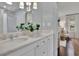 Bright bathroom featuring a double vanity, modern fixtures, and a view to the bedroom at 115 17Th Ne St, Atlanta, GA 30309