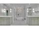 Elegant bathroom with double vanity, a soaking tub, and luxury lighting at 115 17Th Ne St, Atlanta, GA 30309