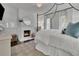 Bright bedroom featuring a fireplace, canopy bed, neutral palette, and natural light at 115 17Th Ne St, Atlanta, GA 30309