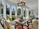 Bright breakfast nook features large windows with views and a rustic table, creating a cozy dining space at 115 17Th Ne St, Atlanta, GA 30309