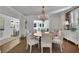 Formal dining room with chandelier, hardwood floors and adjacent butler's pantry at 115 17Th Ne St, Atlanta, GA 30309
