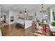 Modern kitchen with a large island, stainless steel appliances, and an adjacent dining area, perfect for entertaining at 115 17Th Ne St, Atlanta, GA 30309