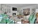 Elegant living room with fireplace, built-in shelving, and beautiful decor, creating a cozy and inviting atmosphere at 115 17Th Ne St, Atlanta, GA 30309