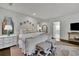 Spacious main bedroom showcasing white decor and a sitting area at 115 17Th Ne St, Atlanta, GA 30309