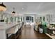 Bright and airy open-concept living area with a kitchen island, large windows, and access to outdoor living space at 115 17Th Ne St, Atlanta, GA 30309