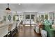 Bright open-concept area connecting the kitchen and living room with outdoor views, offering a relaxed and inviting atmosphere at 115 17Th Ne St, Atlanta, GA 30309