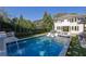 A beautiful inground pool with lounge chairs in a backyard oasis at 115 17Th Ne St, Atlanta, GA 30309