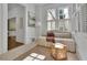 Inviting sitting area with a comfortable daybed, natural light, and elegant decor at 115 17Th Ne St, Atlanta, GA 30309