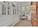 Bright sunroom featuring lots of windows and a cozy chair at 115 17Th Ne St, Atlanta, GA 30309