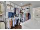 Well-organized walk-in closet offering ample storage space for clothing and shoes at 115 17Th Ne St, Atlanta, GA 30309