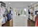 Organized walk-in closet with ample storage and a large center island at 115 17Th Ne St, Atlanta, GA 30309