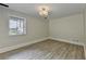 Basement area with luxury vinyl floors and a bright window at 4253 Smithsonia Dr, Tucker, GA 30084