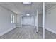 Spacious basement featuring gray wood floors and bright white walls at 4253 Smithsonia Dr, Tucker, GA 30084