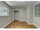 Bedroom featuring hardwood floors, window, and a closet at 4253 Smithsonia Dr, Tucker, GA 30084
